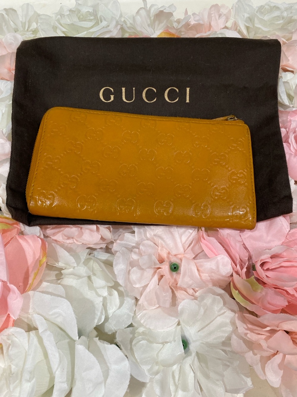 Gucci GG Signature Embossed Zip Wallet